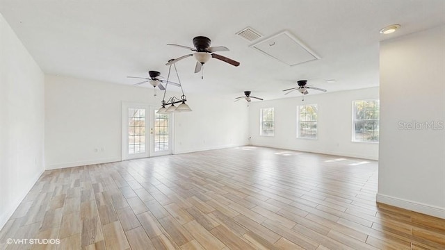 empty room featuring light hardwood / wood-style floors and french doors