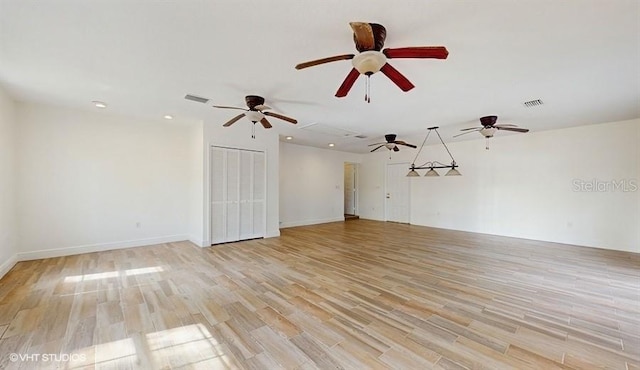 unfurnished living room featuring light hardwood / wood-style floors