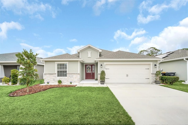 view of front of property with a garage and a front yard