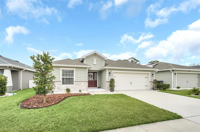 view of front facade with a garage and a front lawn