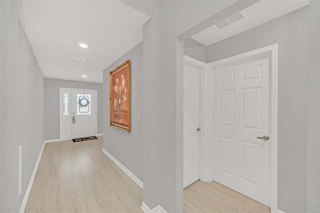 foyer entrance featuring light wood-type flooring