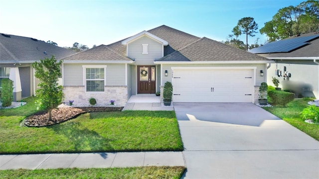 view of front of house featuring a garage and a front yard