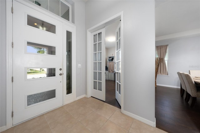 entryway with light tile patterned floors