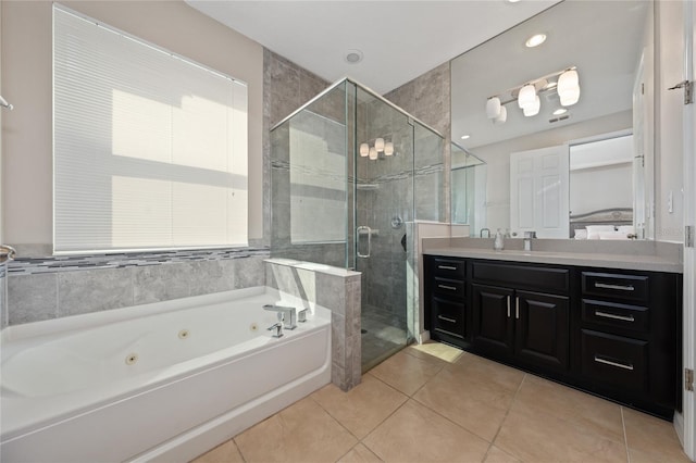 bathroom with vanity, tile patterned floors, and plus walk in shower