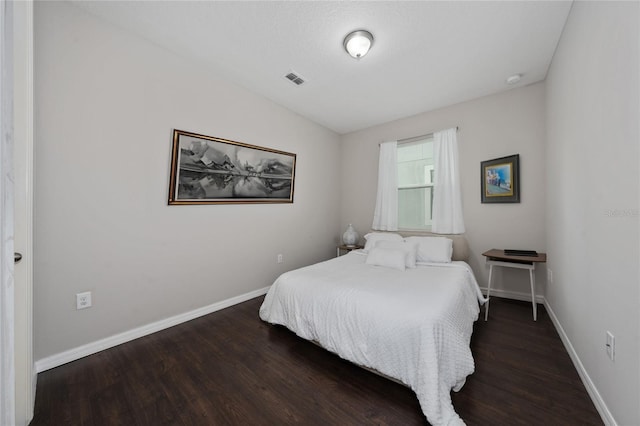 bedroom featuring dark wood-type flooring