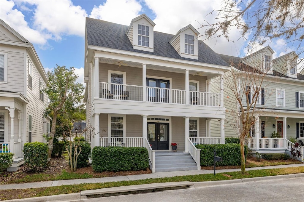 view of front of property with french doors and a porch