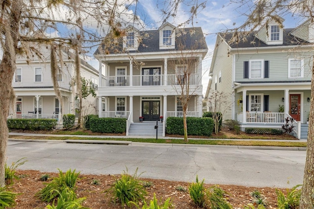 view of front of property with a balcony and covered porch