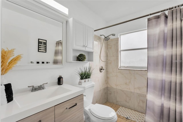 bathroom with vanity, curtained shower, and toilet