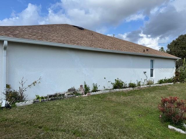 view of home's exterior featuring a lawn