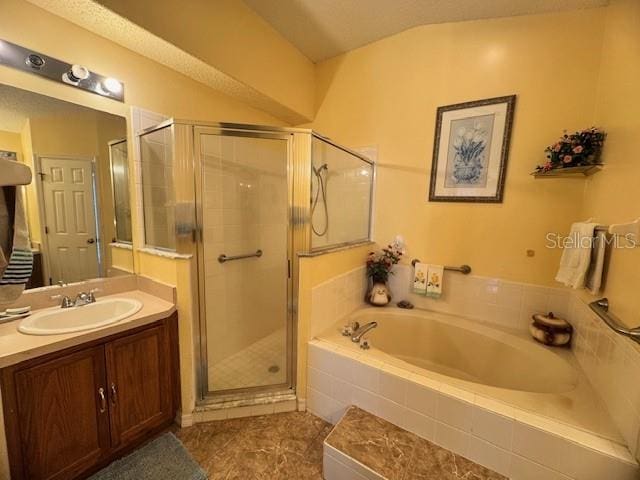 bathroom with tile patterned floors, vanity, plus walk in shower, and vaulted ceiling