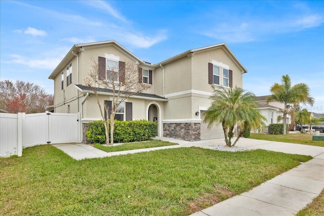 view of front of property featuring a garage and a front lawn