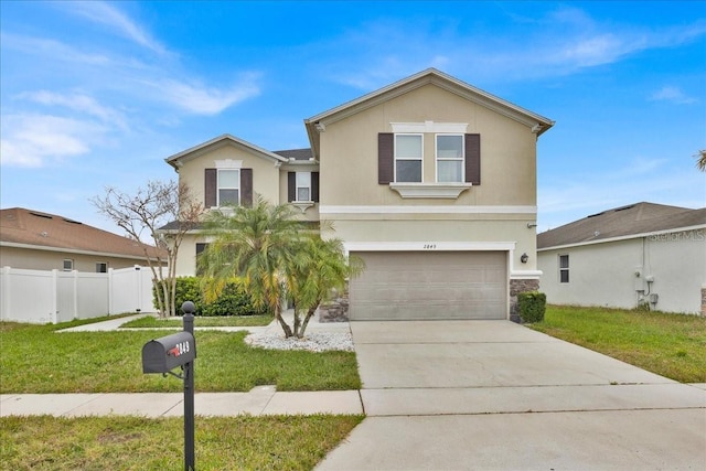 view of front property featuring a garage and a front yard