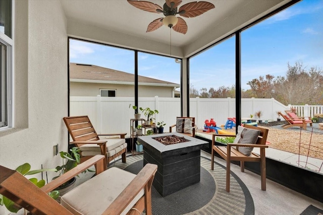 sunroom / solarium featuring ceiling fan