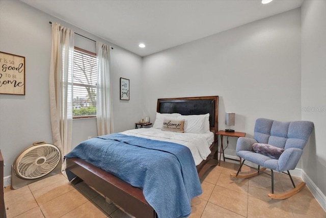 bedroom featuring light tile patterned flooring