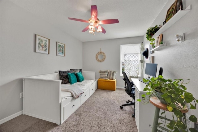 bedroom with ceiling fan and light colored carpet