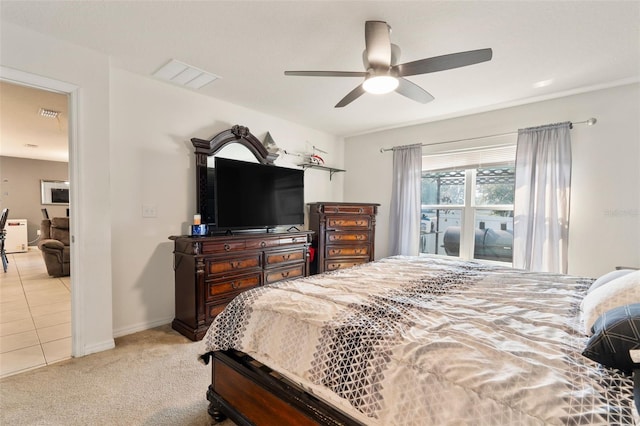 bedroom featuring light carpet and ceiling fan