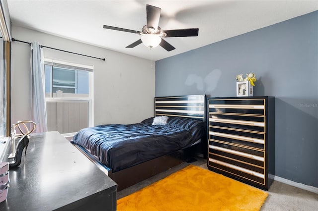 carpeted bedroom featuring ceiling fan