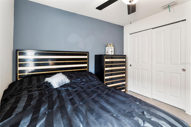 bedroom featuring ceiling fan and a closet