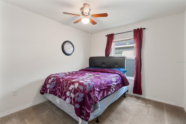 bedroom featuring ceiling fan and carpet