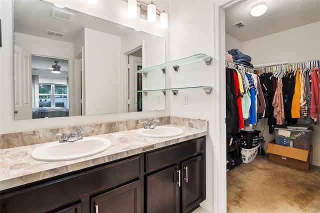 bathroom with vanity and a textured ceiling