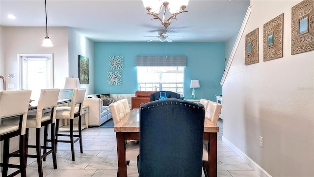 dining space with ceiling fan