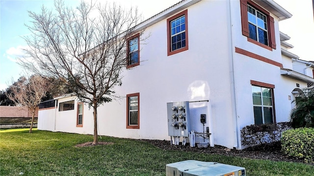 view of side of property featuring a yard