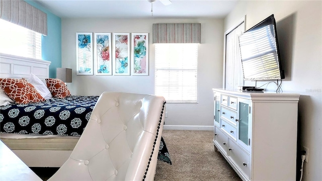 bedroom featuring light carpet