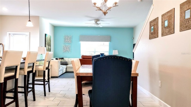 dining space featuring ceiling fan