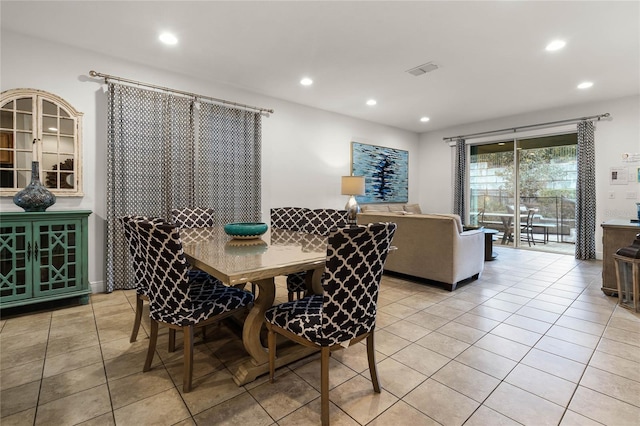 dining space with light tile patterned flooring, visible vents, and recessed lighting