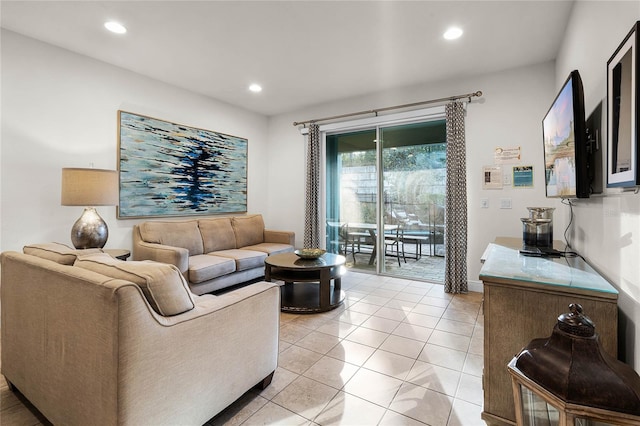 living area featuring light tile patterned floors and recessed lighting