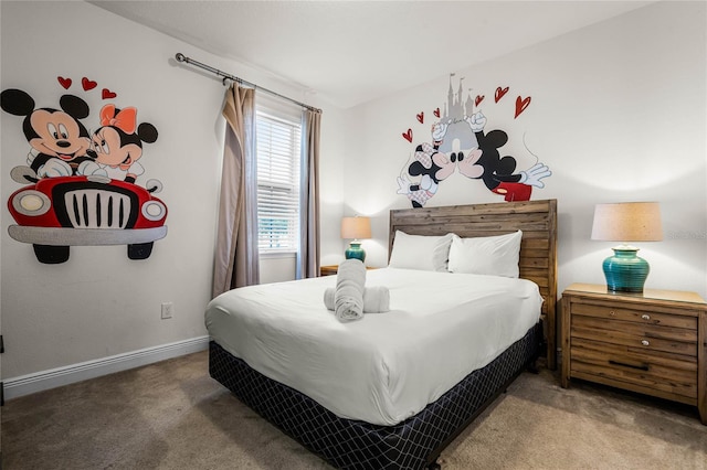 bedroom with carpet floors and baseboards