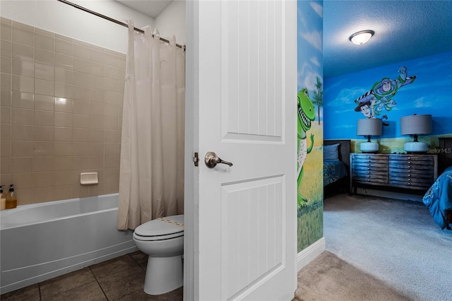 full bath featuring shower / bath combo, baseboards, tile patterned flooring, and toilet