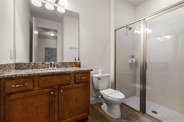 full bathroom with toilet, a stall shower, tile patterned flooring, and vanity