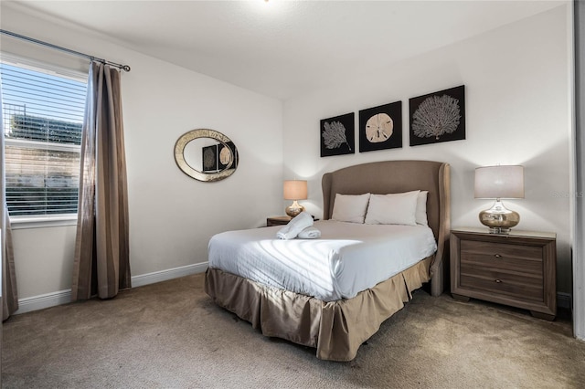 bedroom featuring vaulted ceiling, carpet floors, and baseboards