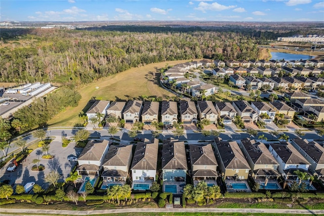 bird's eye view featuring a water view and a residential view