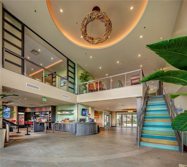 lobby featuring stairs and visible vents