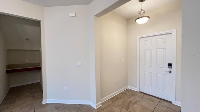 foyer featuring light tile patterned floors