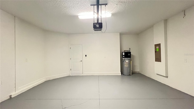 garage with a garage door opener and electric water heater