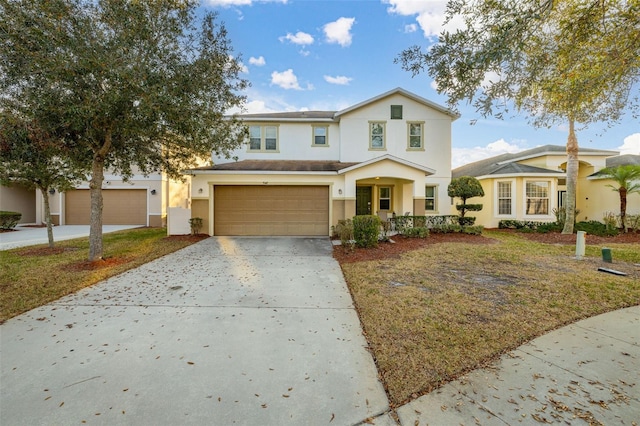 view of front of home featuring a garage and a front yard