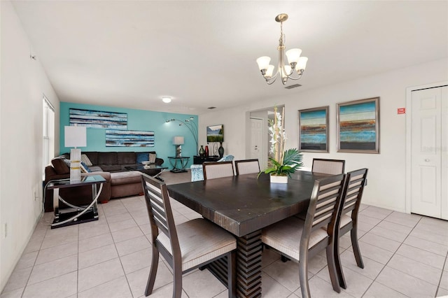 tiled dining space with an inviting chandelier