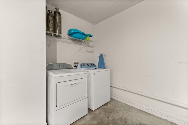 laundry area with washing machine and dryer