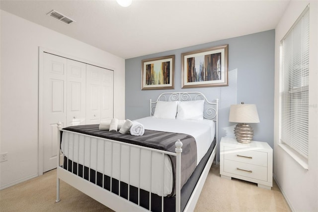 carpeted bedroom with a closet