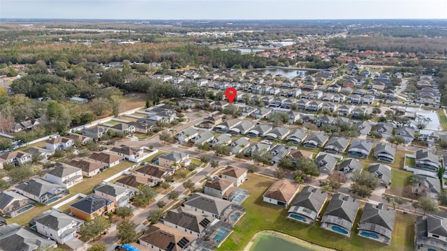 birds eye view of property with a water view