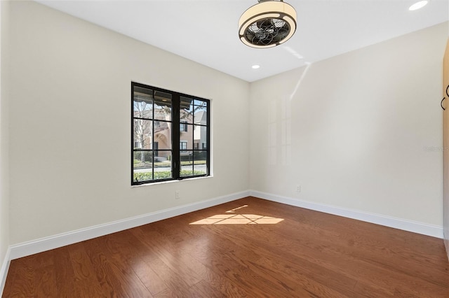 unfurnished room with hardwood / wood-style floors