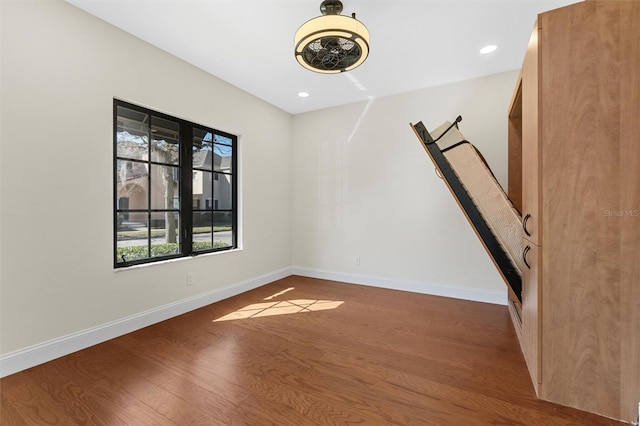 unfurnished room featuring hardwood / wood-style floors