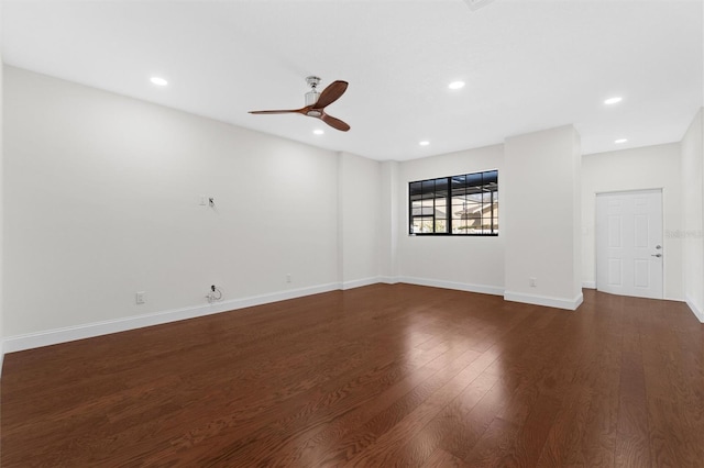 unfurnished room with dark wood-type flooring and ceiling fan