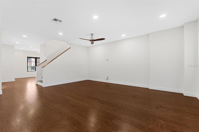 unfurnished living room with ceiling fan and dark hardwood / wood-style flooring