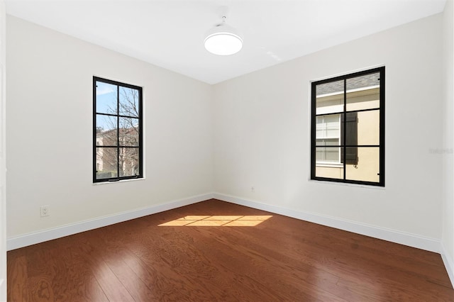 unfurnished room featuring hardwood / wood-style floors