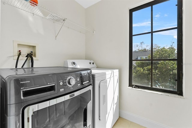 washroom featuring washer and clothes dryer