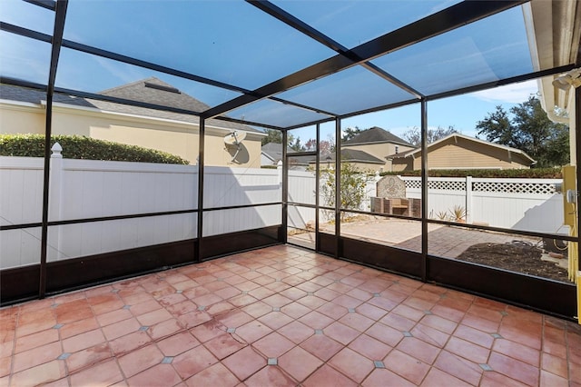 unfurnished sunroom featuring a wealth of natural light